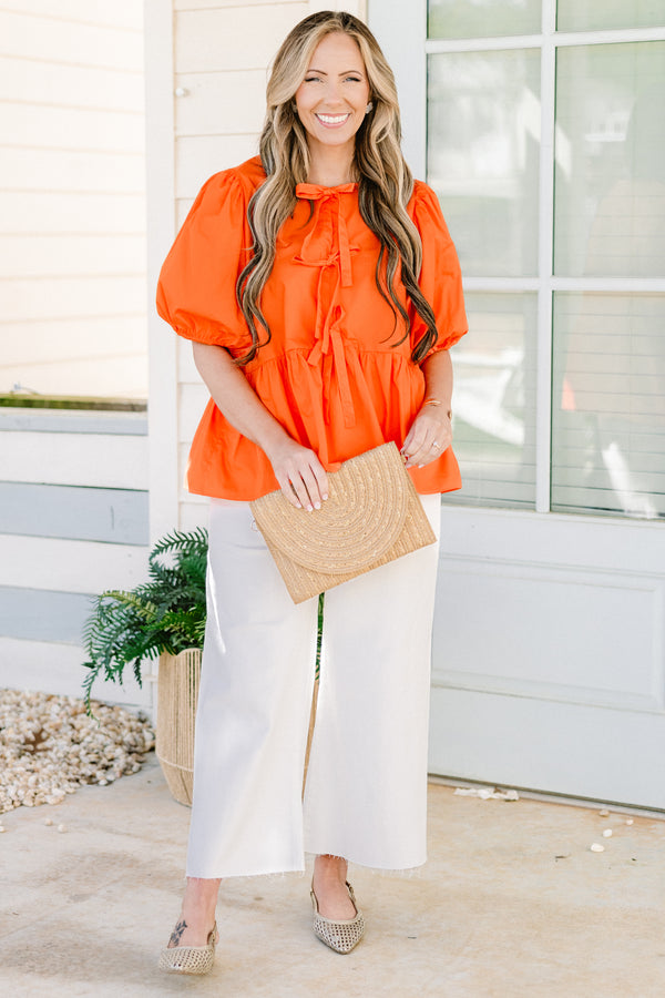 Chic Soul plus size clothing, orange short puff sleeve babydoll top with three bow ties down the front