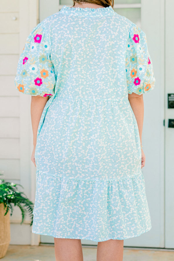 Chic Soul plus size clothing, Turquoise short sleeve dress with a white floral pattern as well as colorful embroidered flowers on the bubble sleeves 