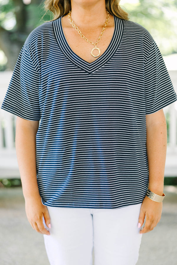 Plus Size navy and white horizontal striped V-neck top with short sleeves and a relaxed fit.