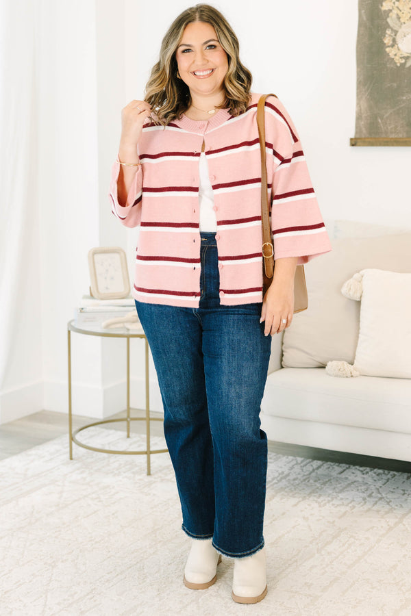 Plus size pink striped cardigan with a relaxed fit, button-down front, and soft knit fabric.