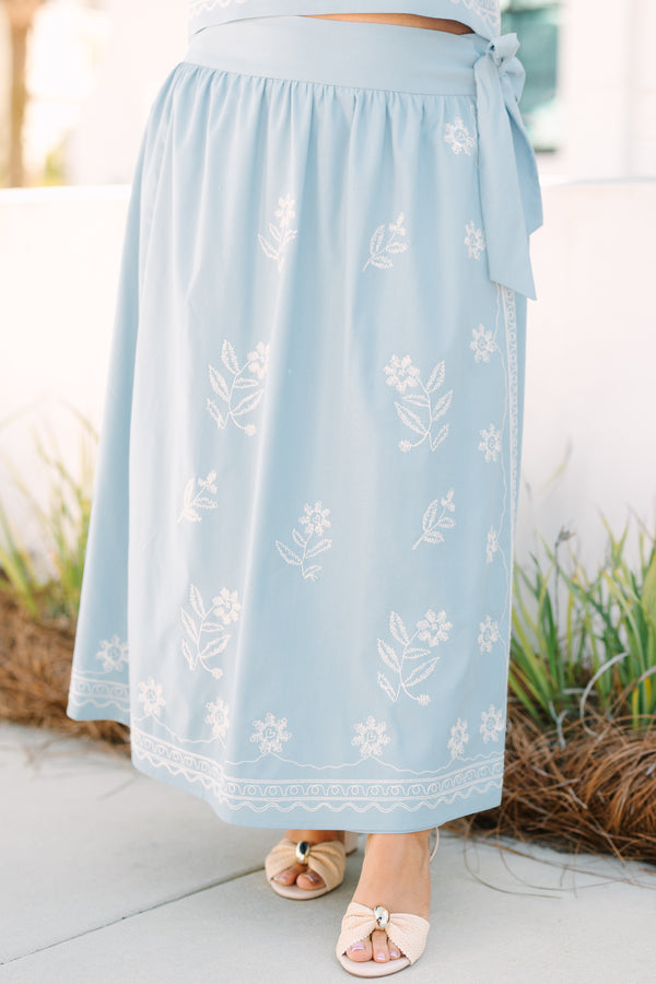 Chic Soul plus size clothing, blue skirt with a white embroidered floral pattern throughout the skirt as well as a bow that ties on the left side of the skirt 