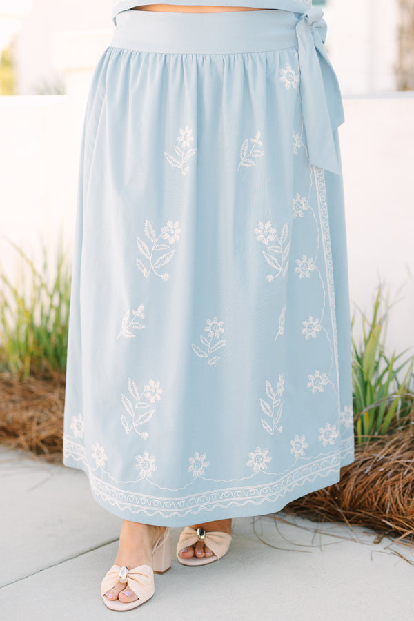 Chic Soul plus size clothing, blue skirt with a white embroidered floral pattern throughout the skirt as well as a bow that ties on the left side of the skirt 