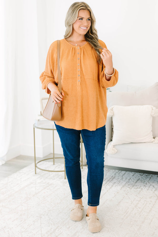 Chic Soul plus size clothing, rust colored baby doll top with buttons going down to the chest and three quarter inch bubble sleeves 