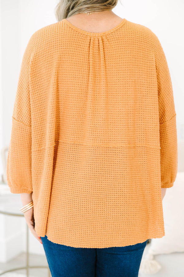Chic Soul plus size clothing, rust colored baby doll top with buttons going down to the chest and three quarter inch bubble sleeves 