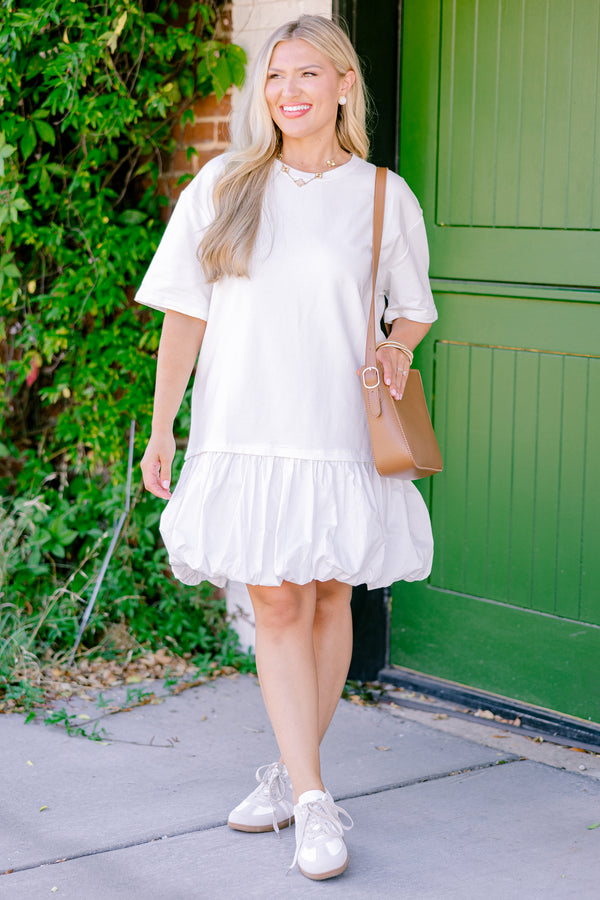 Plus Size ivory drop waist dress with short sleeves and a playful bubble hem.
