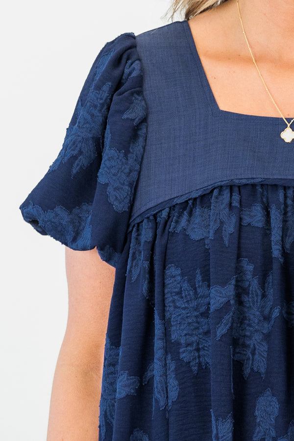 Chic Soul plus size clothing, navy flowy babydoll top with floral embroidery and puff sleeves