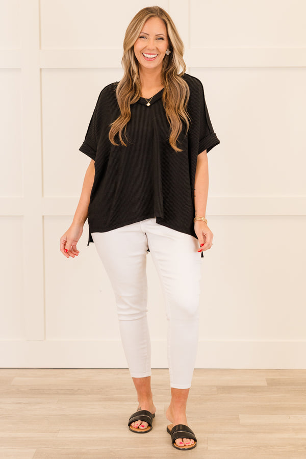 Plus Size black corded rib knit top with short sleeves, a v-neckline, and a hi-low hemline.