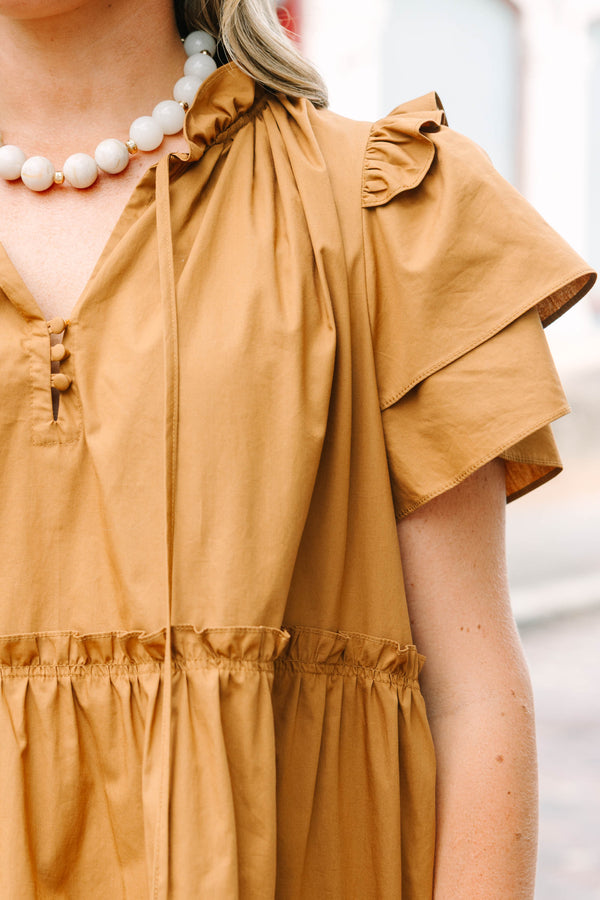 Plus Size tiered brown babydoll dress with flutter sleeves, a ruffled neckline, and tie details.