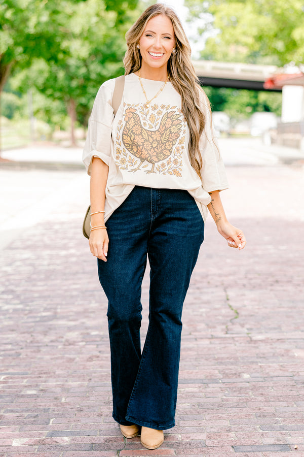 Chic Soul plus size clothing, dust colored short sleeve boyfriend tee with a turkey graphic on the center of the tee that is filled with a fall leaves pattern and also has leaves around the turkey 