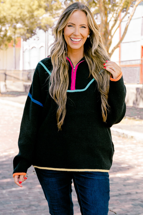 Plus Size black knit quarter-zip sweater with vibrant multi-colored piping and orange cuffs.