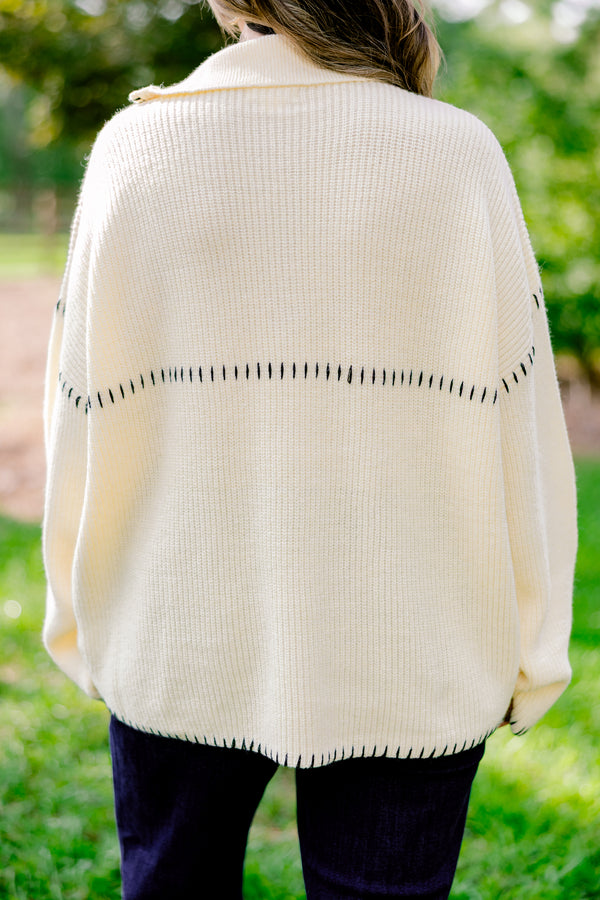 Chic Soul plus size clothing, cream quarter zip sweater with black embroidery detailing on the hem, sleeves, and neckline