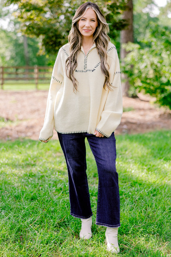 Chic Soul plus size clothing, cream quarter zip sweater with black embroidery detailing on the hem, sleeves, and neckline