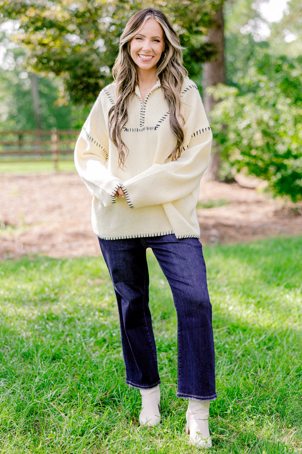 Chic Soul plus size clothing, cream quarter zip sweater with black embroidery detailing on the hem, sleeves, and neckline