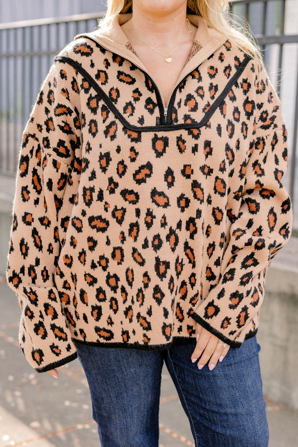 Chic Soul plus size clothing, leopard long sleeve that has a zipper going down to the chest as well has black stitching details around the bottom of the sweater and along the neckline 