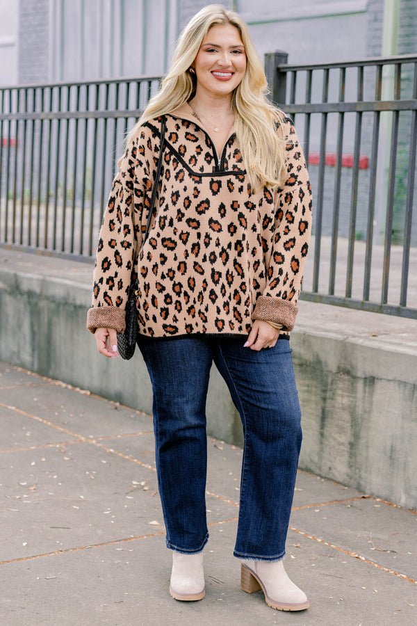 Chic Soul plus size clothing, leopard long sleeve that has a zipper going down to the chest as well has black stitching details around the bottom of the sweater and along the neckline 
