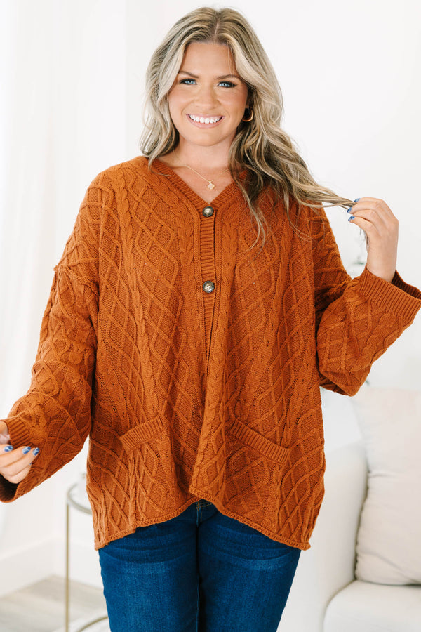 Plus Size brown cable knit cardigan with a V-neckline, button-front, and front pockets.