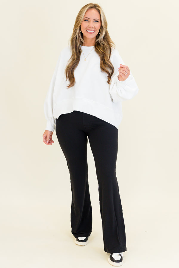 Plus Size black flare leggings in a butter soft fabric with a high-waisted fit.