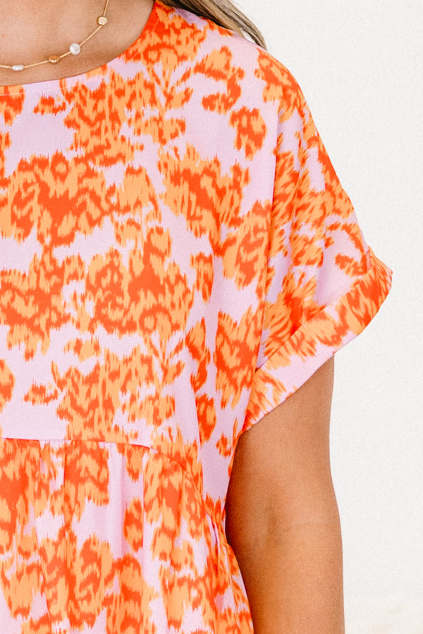 Chic Soul plus size clothing, orange short sleeve babydoll top with a light pink abstract pattern 
