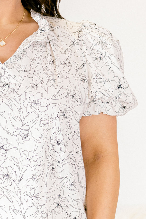 Chic Soul plus size clothing, white floral short sleeve top with v cutout along neckline with puff sleeve detail