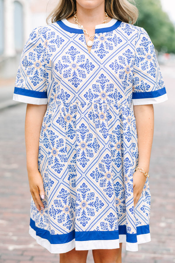 Plus Size blue and white tile print babydoll dress with a v-neckline and short sleeves.
