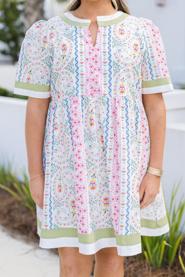 Chic Soul plus size clothing, green multi color knee length dress with short sleeves and a floral pattern throughout as well as a green solid stripe going around the bottom of the dress, end of each sleeve and around the neckline 