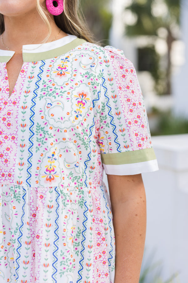 Chic Soul plus size clothing, green multi color knee length dress with short sleeves and a floral pattern throughout as well as a green solid stripe going around the bottom of the dress, end of each sleeve and around the neckline 