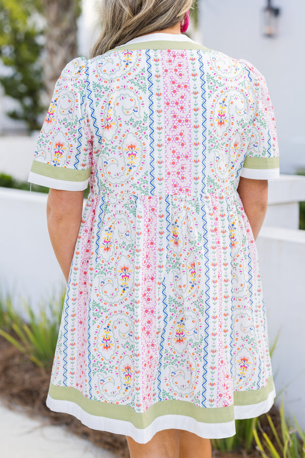 Chic Soul plus size clothing, green multi color knee length dress with short sleeves and a floral pattern throughout as well as a green solid stripe going around the bottom of the dress, end of each sleeve and around the neckline 