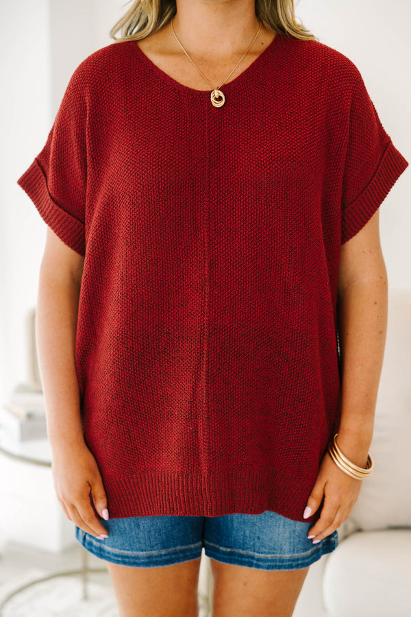 Plus size Cabernet red short sleeve knit sweater with a relaxed fit and ribbed hem.
