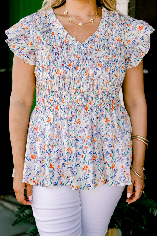 Chic Soul Plus size clothing, Ivory baby doll top with a floral pattern, slight v-neckline and flutter sleeves 
