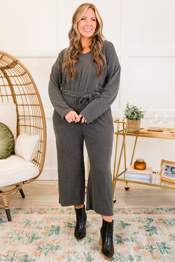 Chic Soul plus size clothing, charcoal long sleeve ribbed knit jumpsuit with cinched waist with tie detail and v neckline with cropped length pants with slight flare