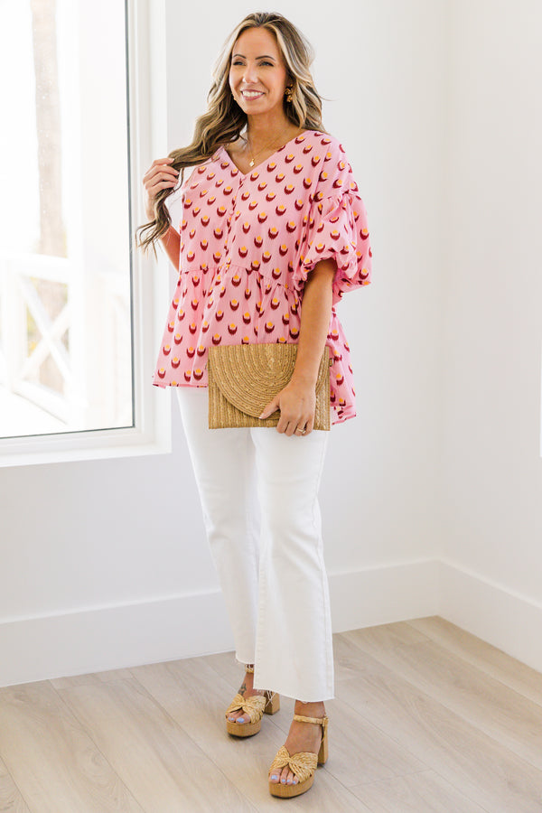 Chic Soul plus size clothing, pink short sleeve baby doll blouse with button up detail down the front with v neckline with bubble sleeves with abstract yellow/fuchsia print