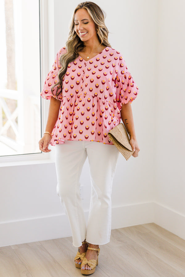 Chic Soul plus size clothing, pink short sleeve baby doll blouse with button up detail down the front with v neckline with bubble sleeves with abstract yellow/fuchsia print