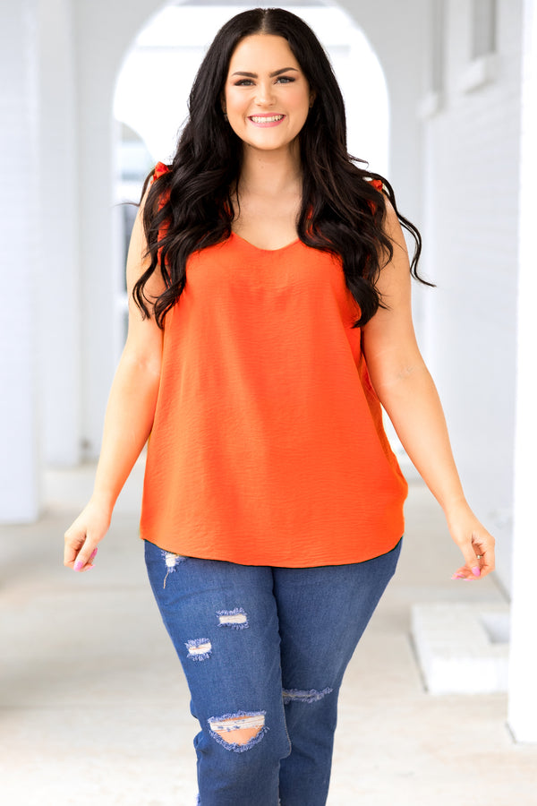 Plus Size sleeveless orange V-neck top in a textured, lightweight fabric.