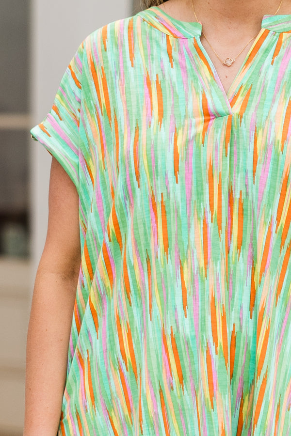 Chic Soul plus size clothing, green top with multicolor paint swatch pattern and a v neck