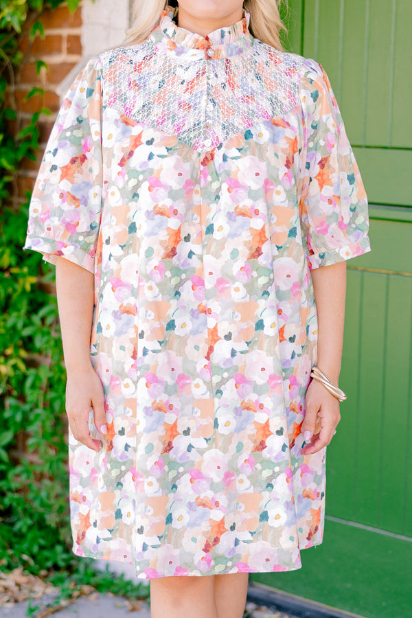 Chic Soul plus size clothing, pink multi colored short sleeve dress with an abstract floral pattern a high neck and a ruffle detailed collar 