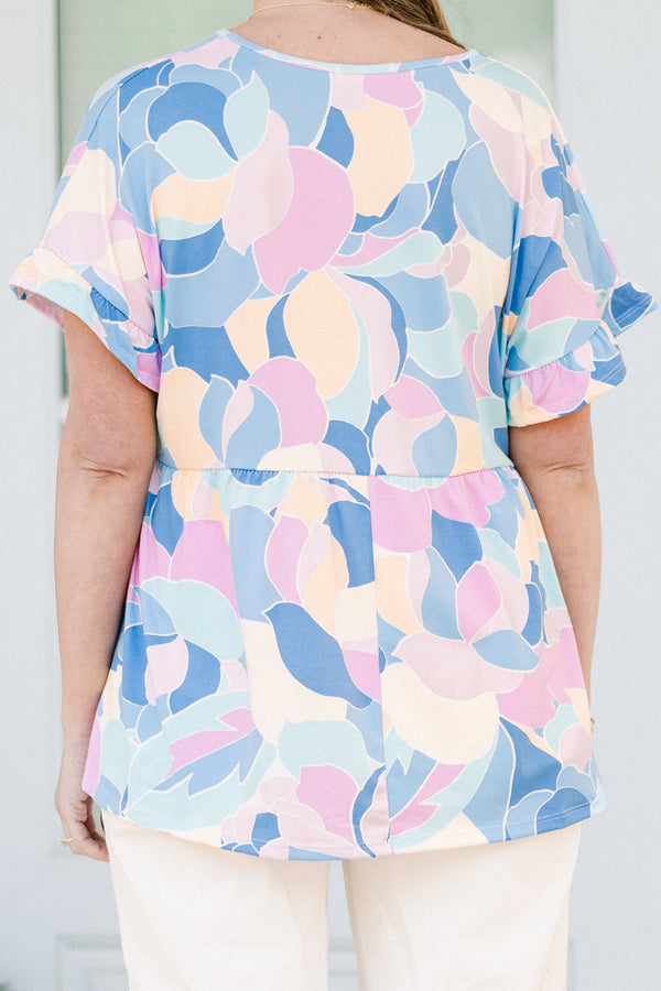 Plus Size blue abstract print babydoll top with a v-neck and short ruffled sleeves.