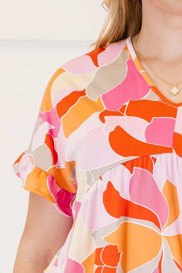 Chic Soul plus size clothing, Basic purple short sleeve babydoll top, with a multi-color abstract pattern, a ruffle accent at the end of the sleeves and a slight v-neck 
