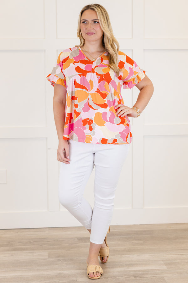 Chic Soul plus size clothing, Basic purple short sleeve babydoll top, with a multi-color abstract pattern, a ruffle accent at the end of the sleeves and a slight v-neck 
