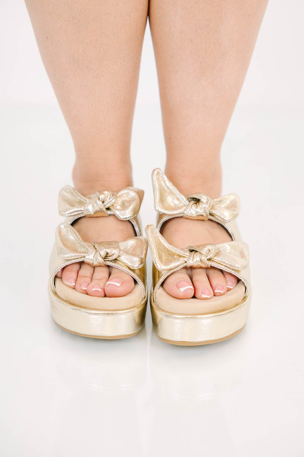Plus Size gold metallic platform sandals with two straps featuring decorative bow details.