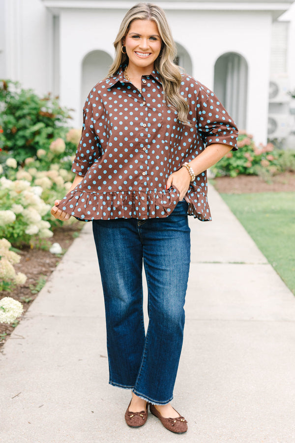 Plus Size brown button-down top with blue polka dots, short sleeves, and a ruffled hem.