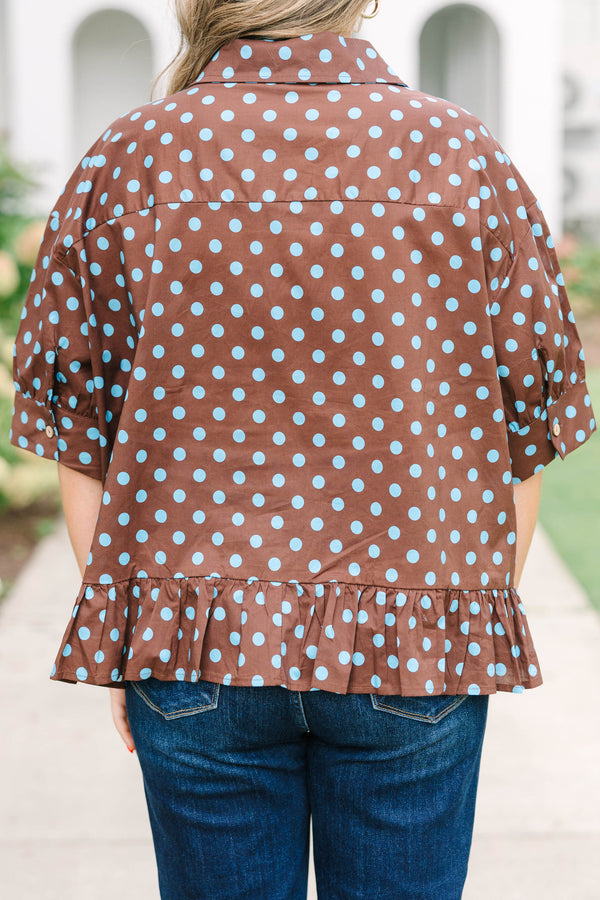 Plus Size brown button-down top with blue polka dots, short sleeves, and a ruffled hem.