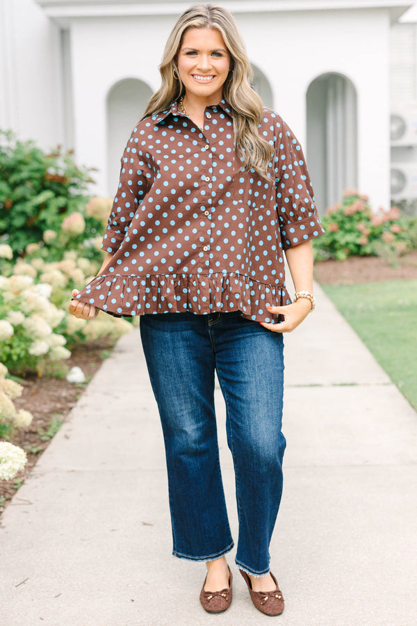 Plus Size brown button-down top with blue polka dots, short sleeves, and a ruffled hem.