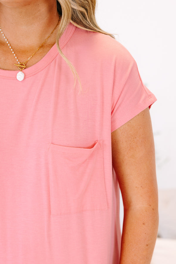 Plus Size short sleeve crew neck mini dress in blossom pink with a front pocket.