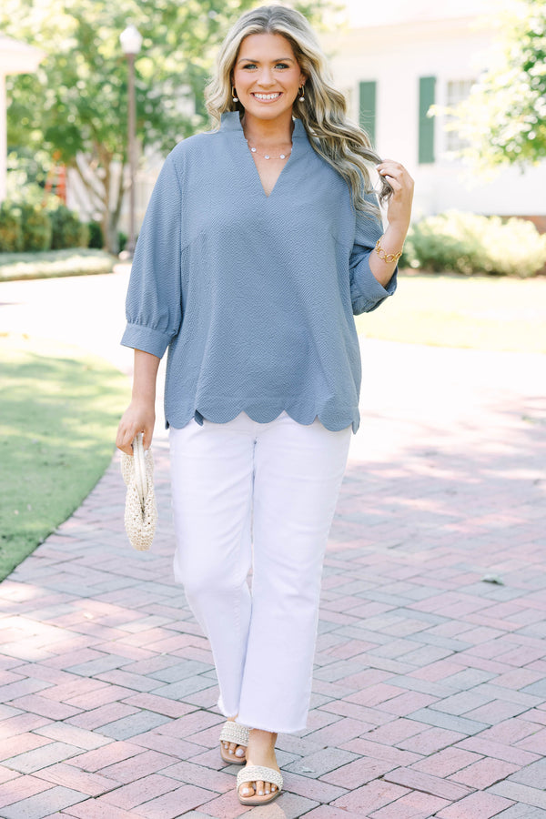 Plus Size steel blue textured top with a V-neckline and three-quarter length puff sleeves.