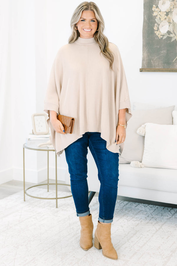 Plus Size taupe ribbed knit poncho with a mock neckline and wide, draped sleeves.