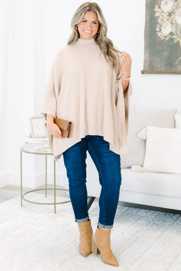 Plus Size taupe ribbed knit poncho with a mock neckline and wide, draped sleeves.