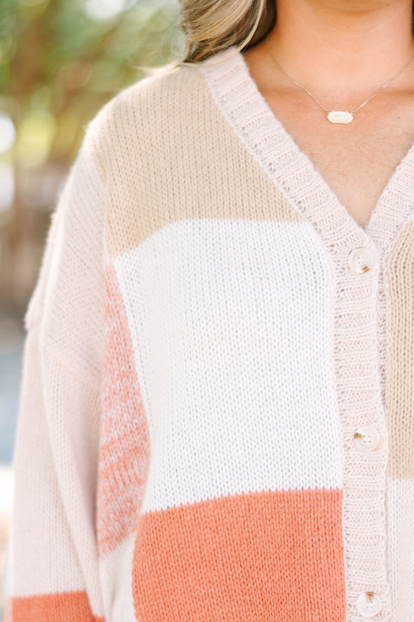 Plus size colorblock knit cardigan in multi-color peach, tan, and cream with a relaxed, flowy fit.