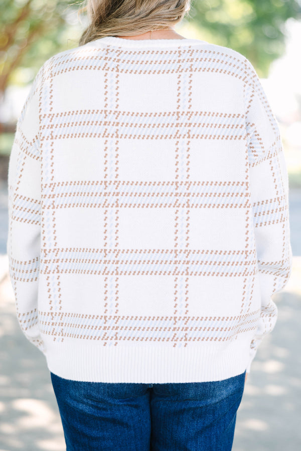 Plus Size ivory crewneck sweater with a tan and blue plaid pattern and long sleeves.