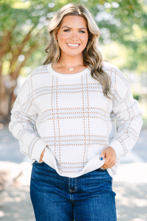 Plus Size ivory crewneck sweater with a tan and blue plaid pattern and long sleeves.