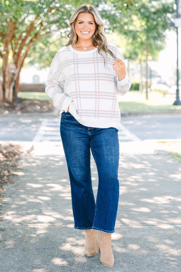 Plus Size ivory crewneck sweater with a tan and blue plaid pattern and long sleeves.